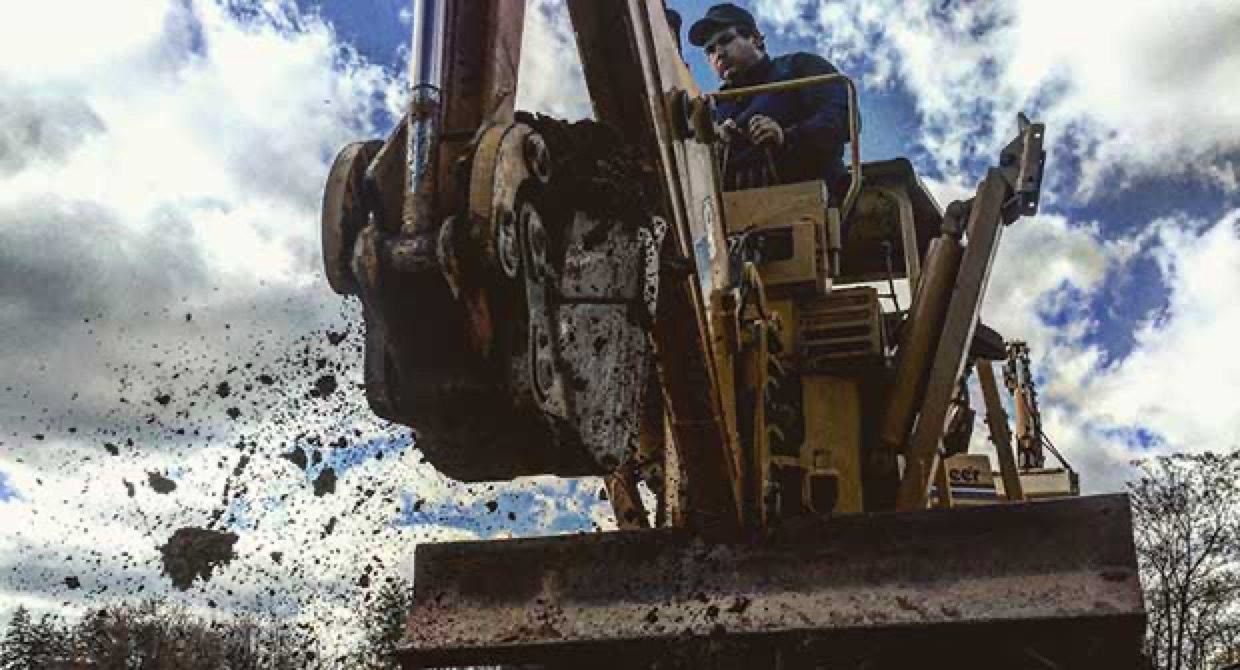 Excavator on a Blue Jay Irrigation project site — Landscape Management feature
